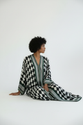 Editorial seated - no scarf, side pose